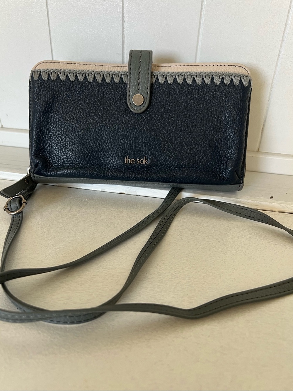 The Sak blue and Gray Crossbody Wallet with Cream Trim